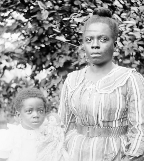 a black and white photo of a woman and a child