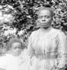 a black and white photo of a woman and a child