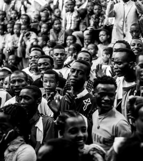 grayscale photo mass of people