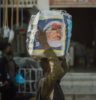 a person carrying a bag of food