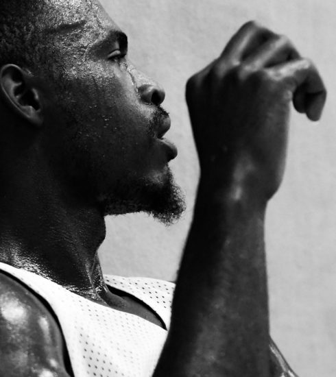 grayscale photo of man in tank top