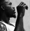 grayscale photo of man in tank top