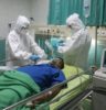 man in white medical scrub lying on hospital bed
