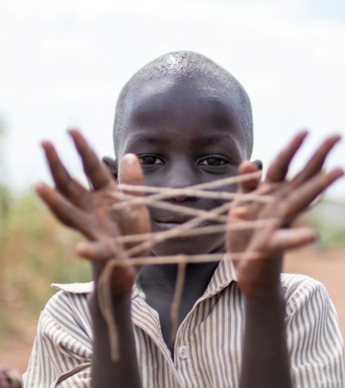 boy showing hand with rubber