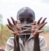 boy showing hand with rubber