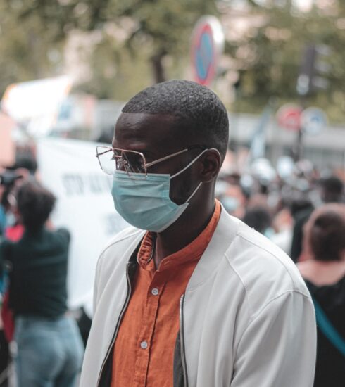 man in white button up shirt wearing black sunglasses
