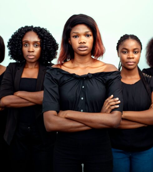 woman in black dress standing beside woman in black dress